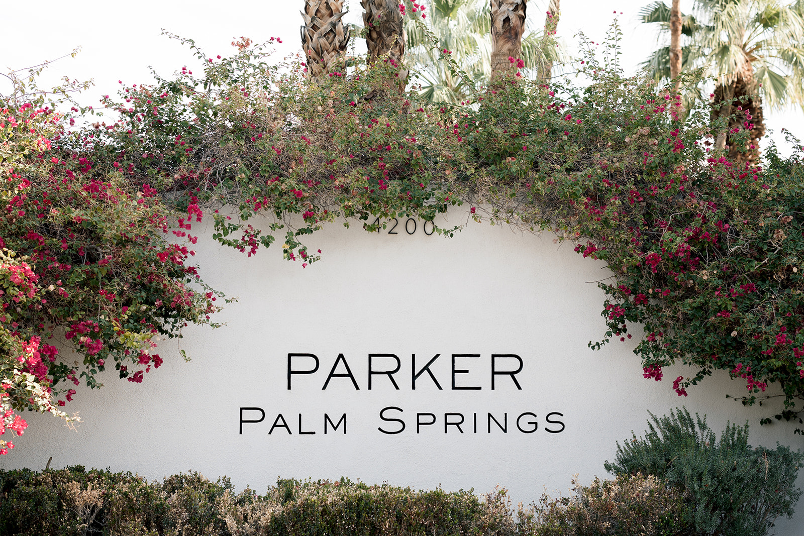 The outdoor entrance sign of The Parker Palm Springs wedding venue.