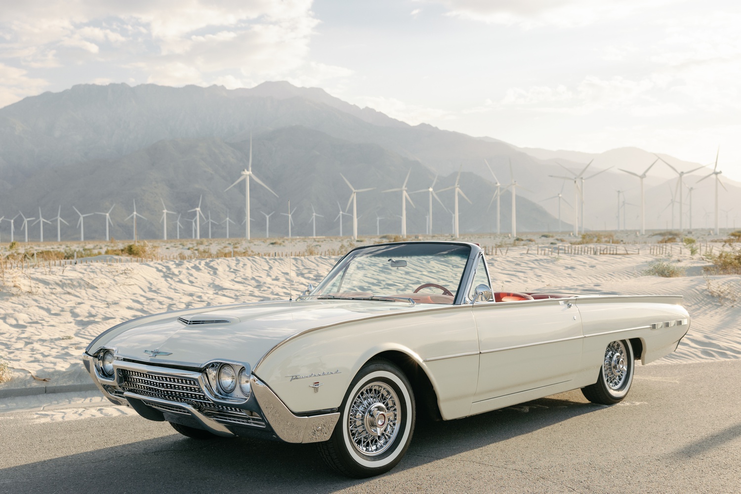 a white vintage convertible car parked for California engagement photos
